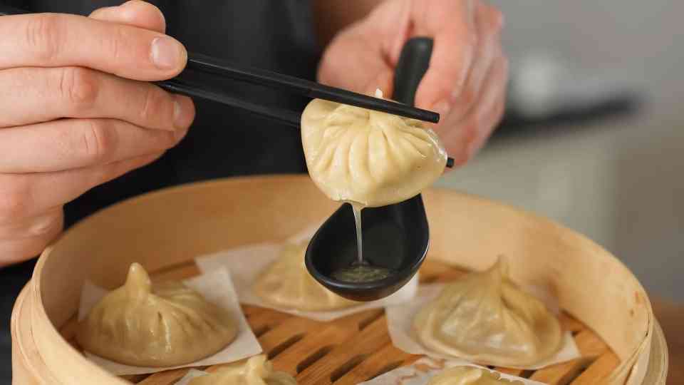 A steamed dumpling filled with a hidden broth technique