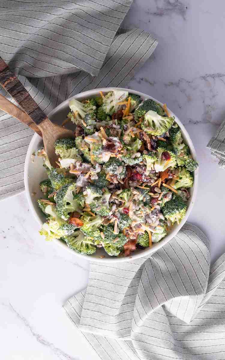 Overhead of a serving bowl of bacon broccoli salad with cheese.