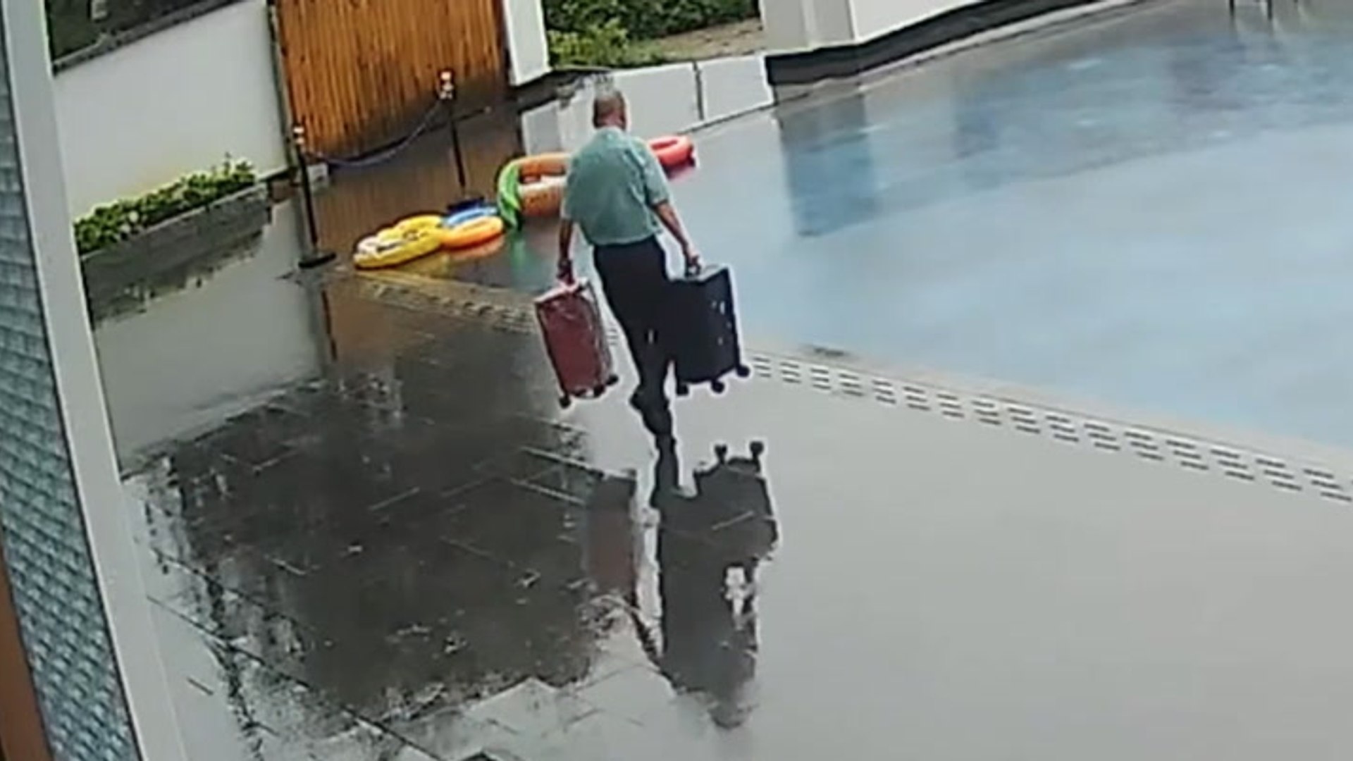 Hotel porter walks straight into 'invisible' swimming pool with guests ...