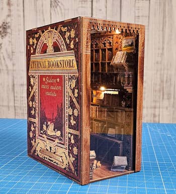 Miniature diorama inside a book titled