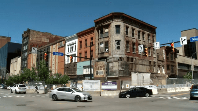 Downtown Rochester eyesore reborn as affordable housing & retail complex