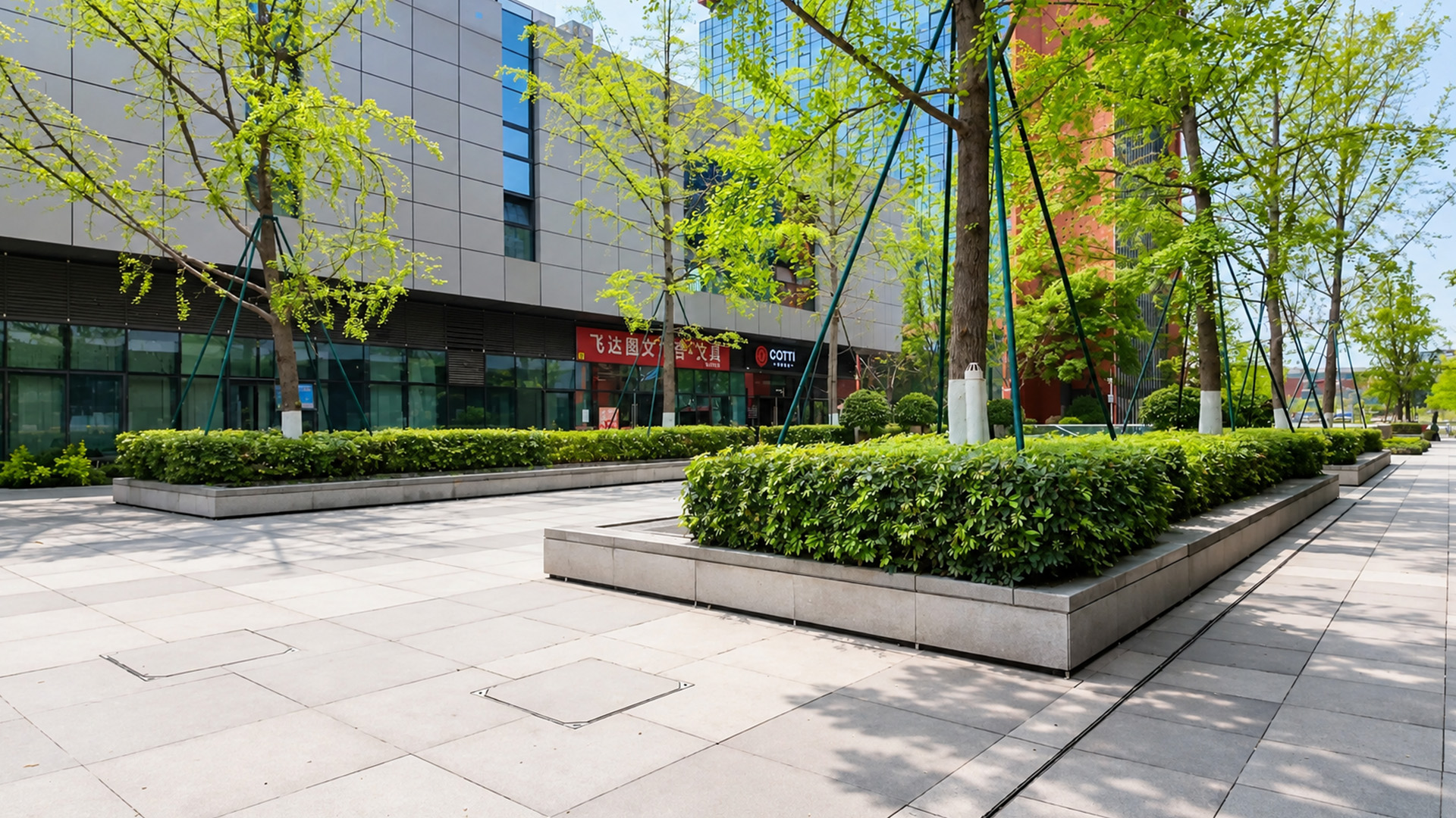 This modern streetscape blends office towers with open green walkways