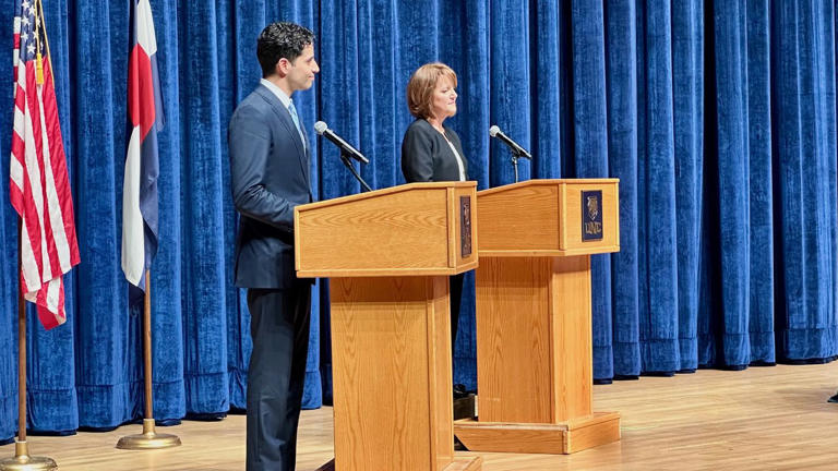 Manny Rutinel and Shannon Bird spar at 8th District debate