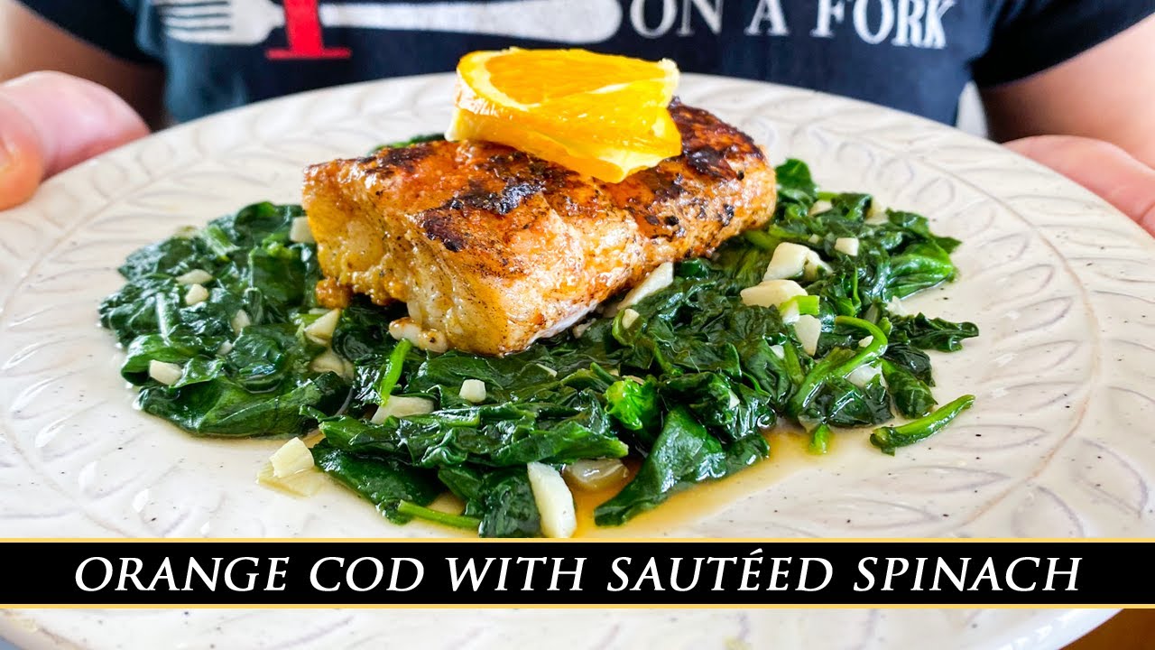 Seville-style orange cod with sautéed spinach
