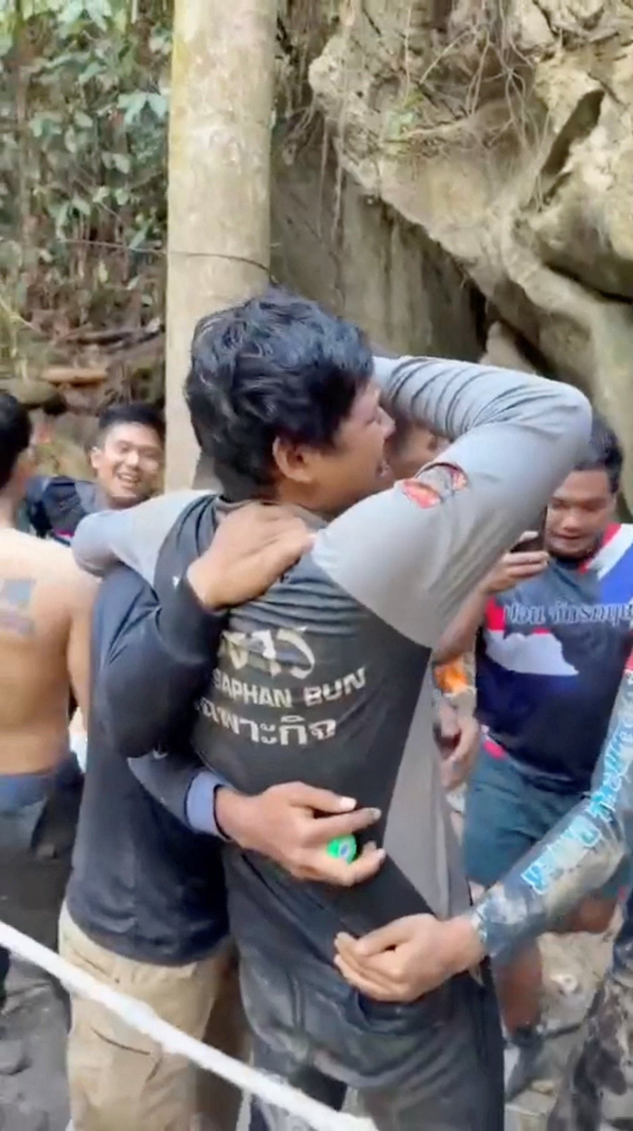 Members of a rescue team celebrate after announcing that they have found people trapped in a cave, in Xaisomboun Province, Laos,27 May 2026 in this screengrab taken from a handout video (Reuters)