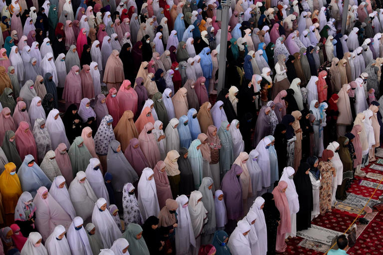Muslims perform the Eid ul-Adha prayer led by an