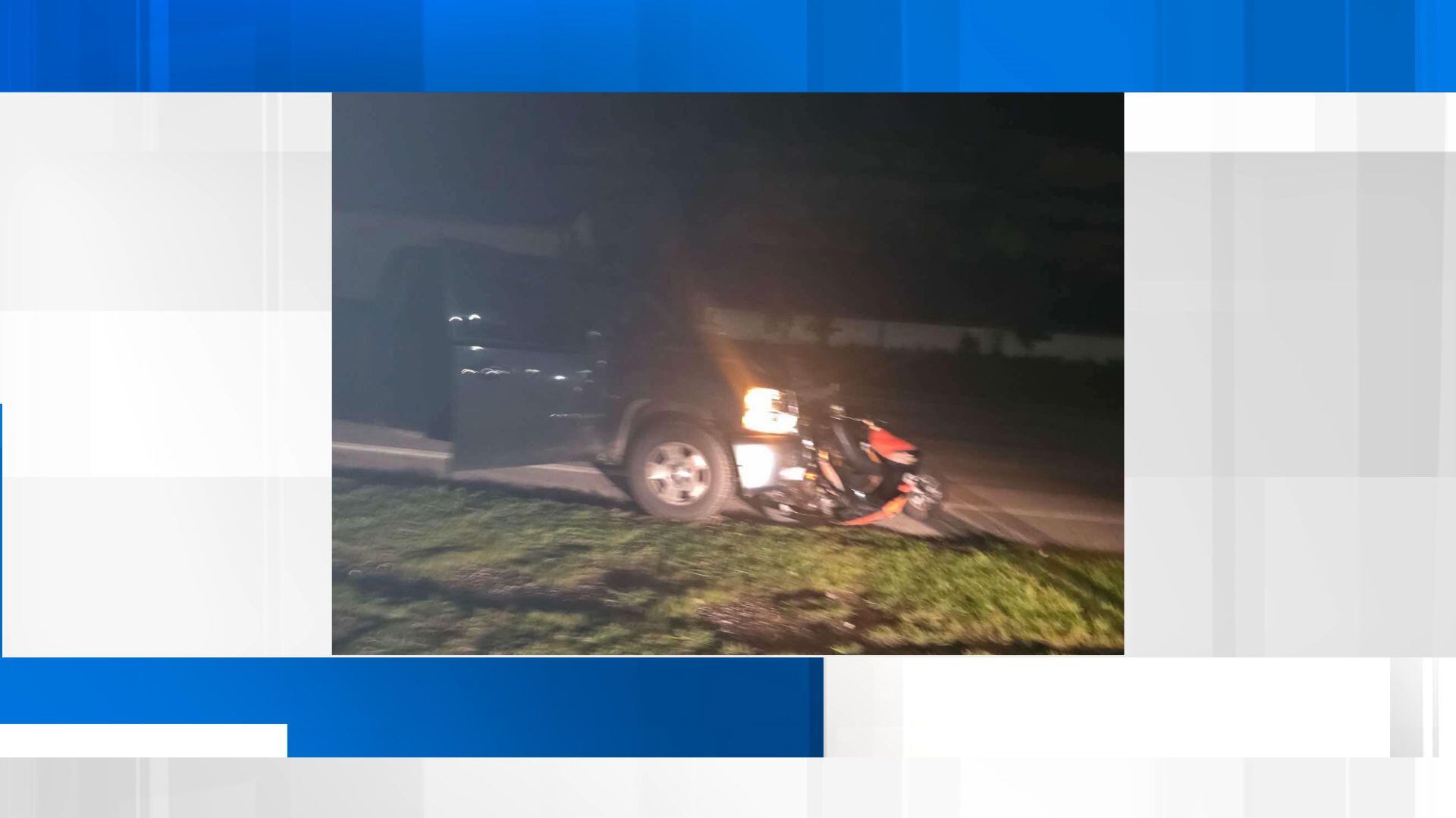 Man hit by car and dragged while riding scooter, police say