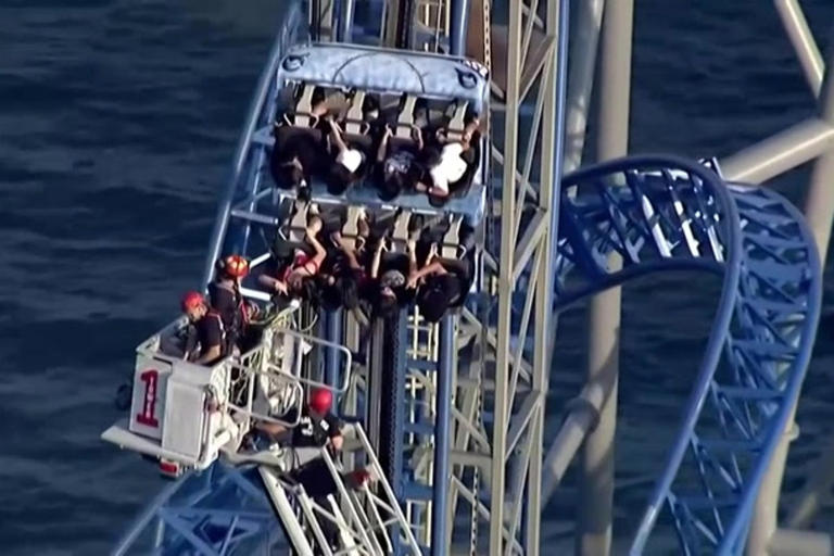 Rollercoaster riders stuck 100ft in air for hours after malfunction