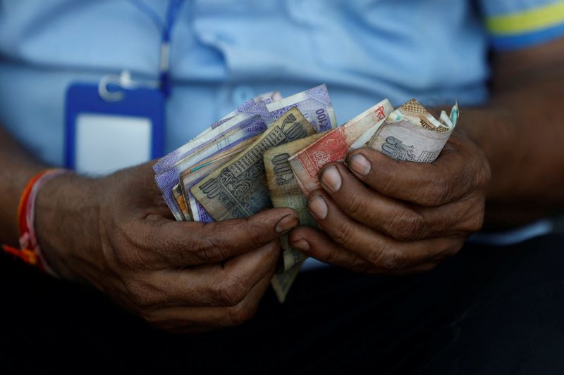India's forex reserves fall to over one-year low as central bank mounts ...