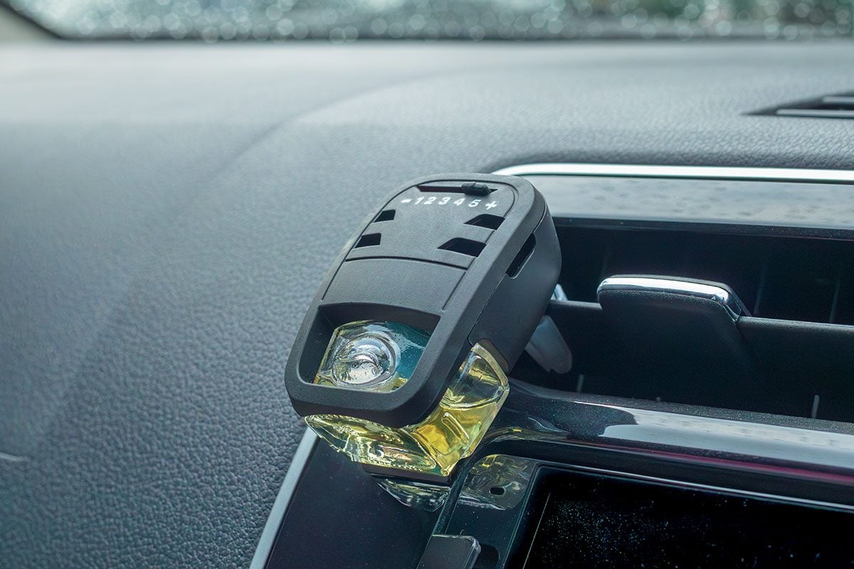 Close up of an air freshener installed in the car AC vent