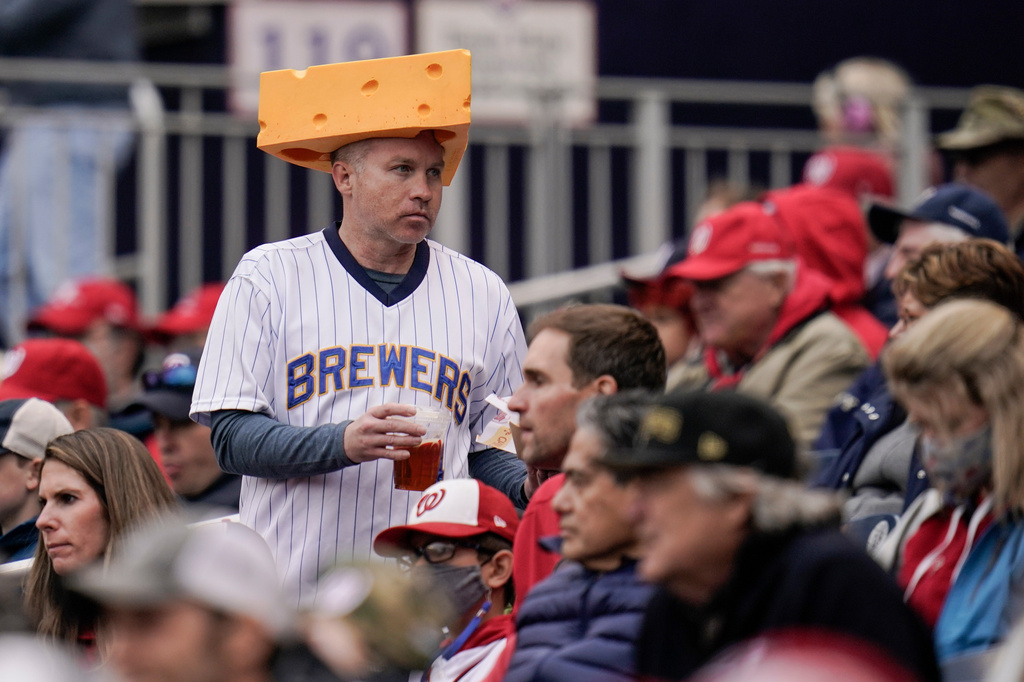 The cheesehead hat is a sunny nod to America's 'hold my beer' exuberance