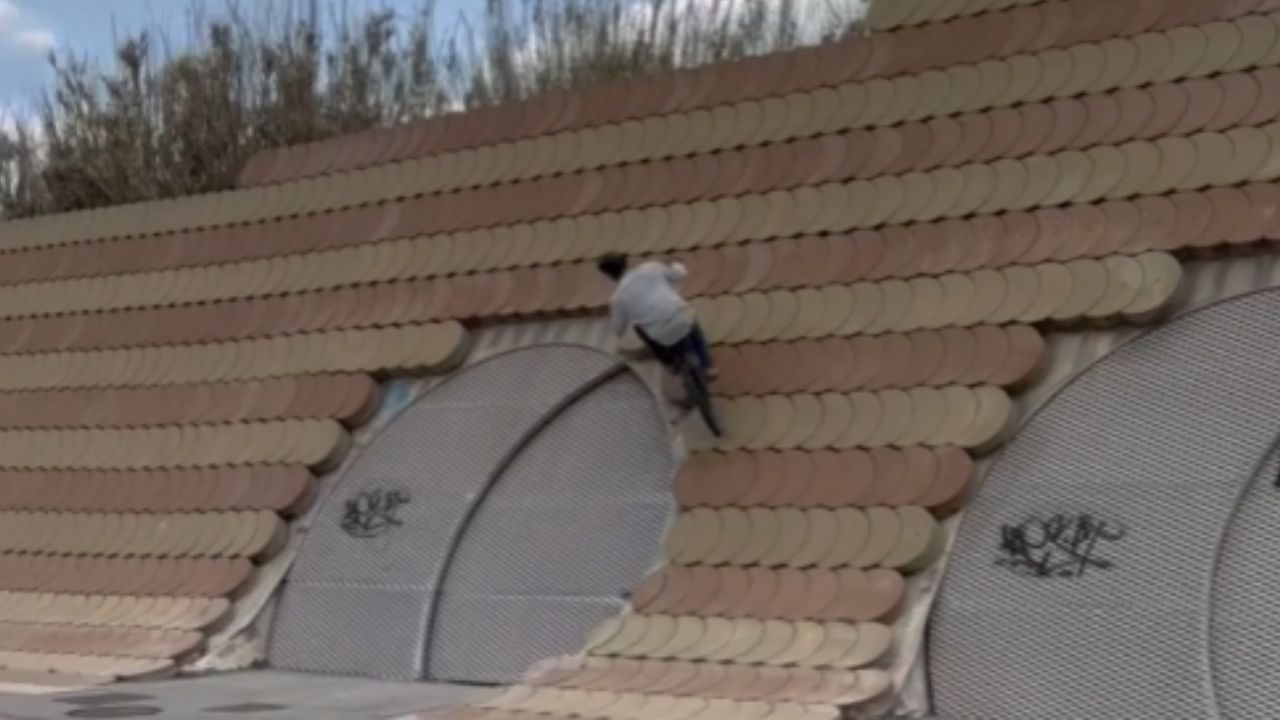 Cyclist displays his brilliance with gravity-defying wall ride & bottle ...