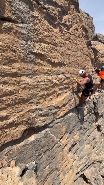 Hanging off this cliff on a breathtaking mountain climb