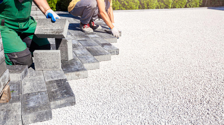 Is it cheaper to lay concrete or pavers?