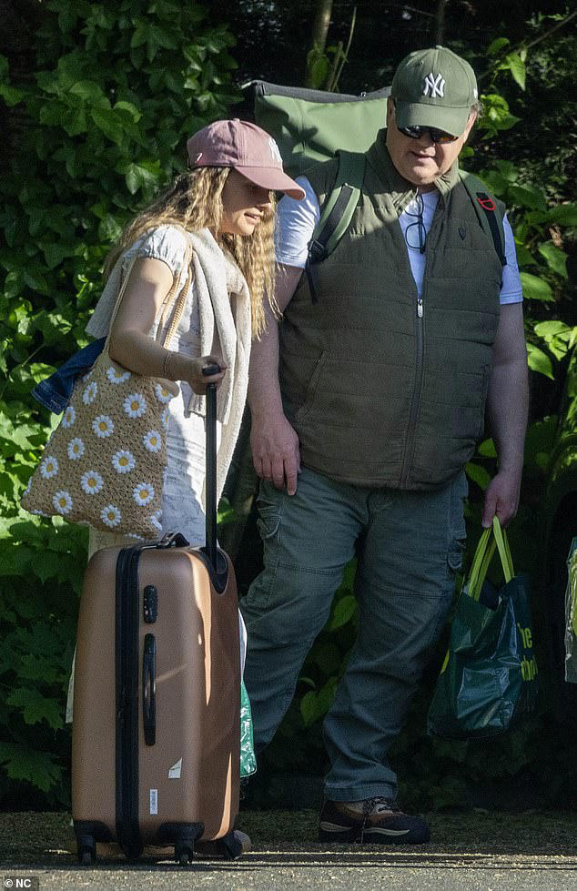 mr-tumble-55-arrives-at-hotel-with-girlfriend-samantha-dorrance-34