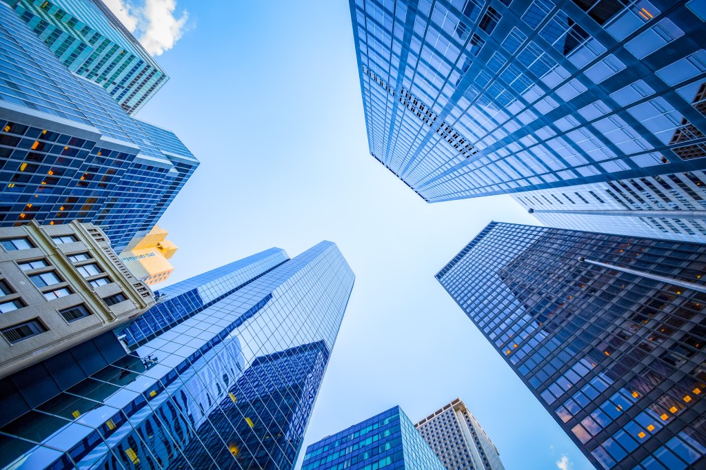 An upward view of skyscrapers in Manhattan's financial district in New York City.