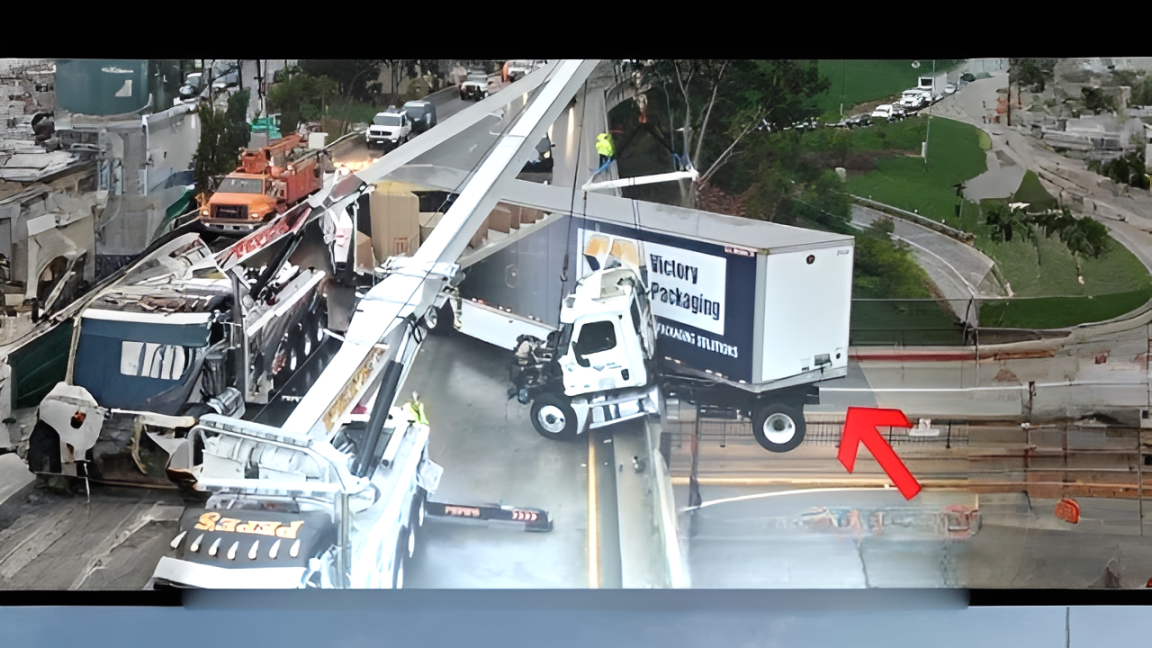 Big rig crashes and is left dangling off freeway bridge in Los Angeles