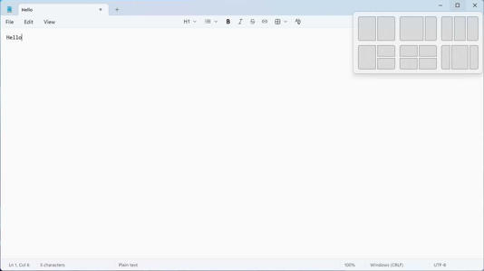 Notepad with the Windows Snap Layout window visible. 