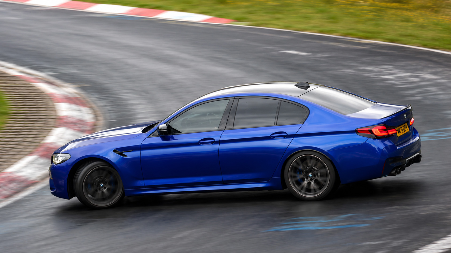 BMW M5 runs out of grip on slippery track