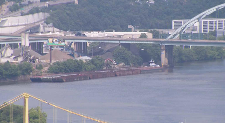 Barge repositioned after caught drifting ashore due to high winds in ...