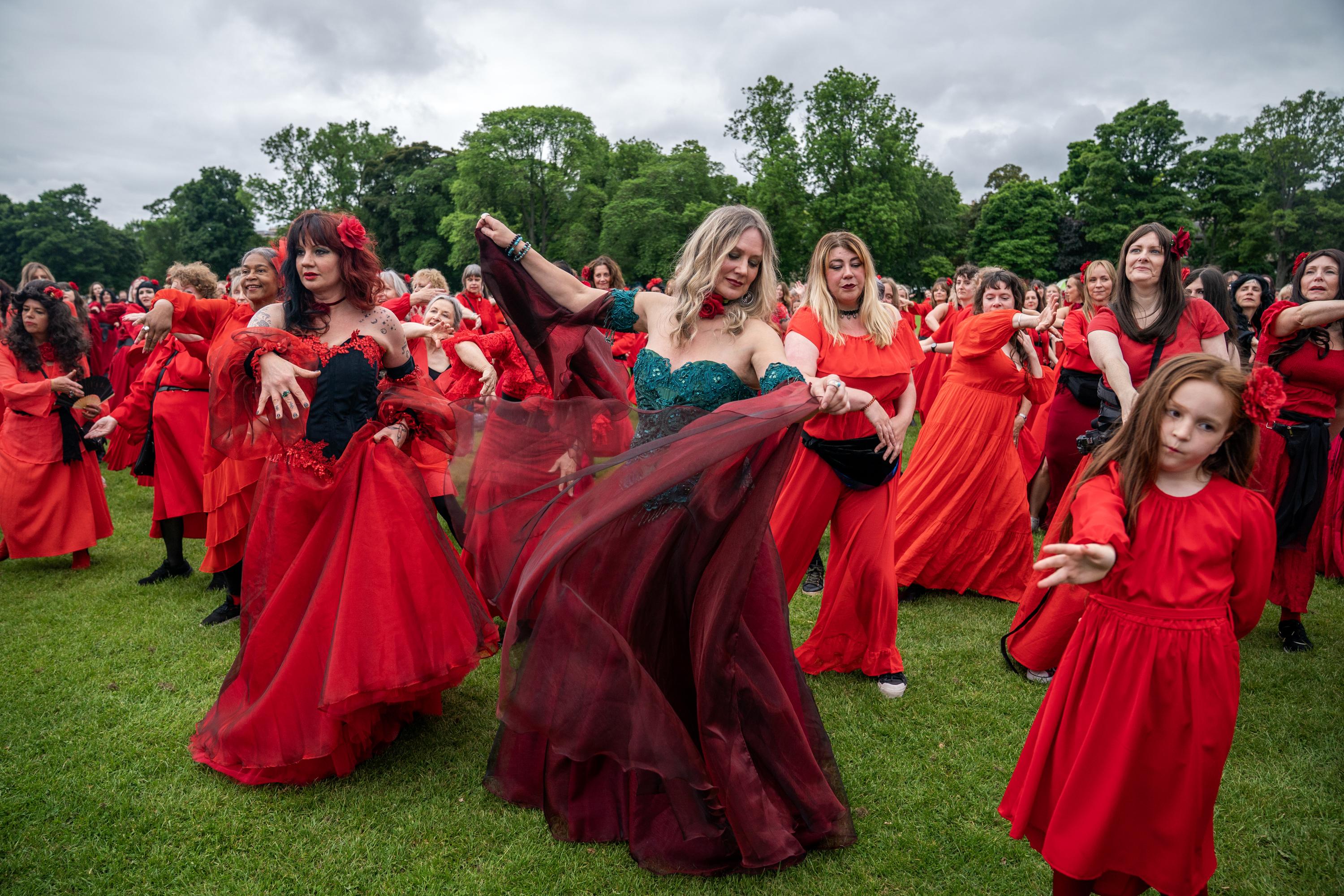 In pictures: Sea of red descends on Edinburgh for mass Kate Bush dance  tribute