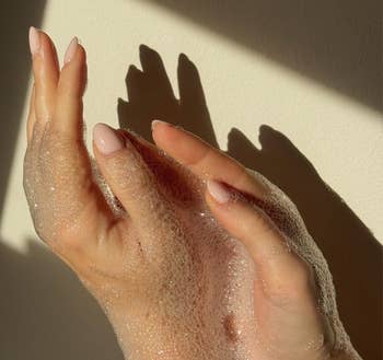 Hands lathered with bubbles. Text reads: