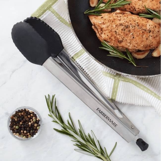 Metal kitchen tongs labeled