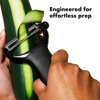 Peeler in use on a cucumber with the text