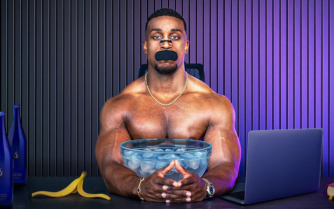 As part of his morning routine, Ashton Hall plunges his face into ice water, wearing mouth and nose tape to promote better breathing