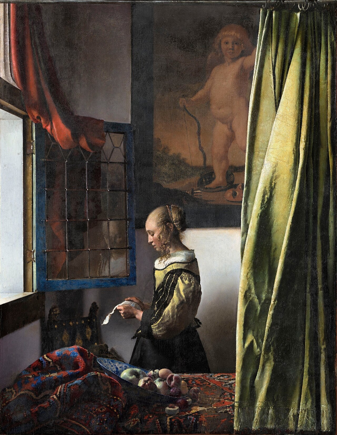Woman reading love letter by window