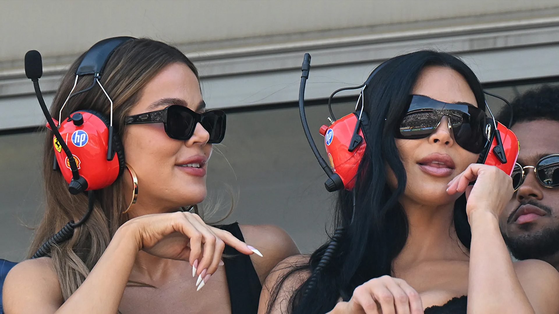 Kim Kardashian and Khloe Kardashian wear white at Monaco Grand