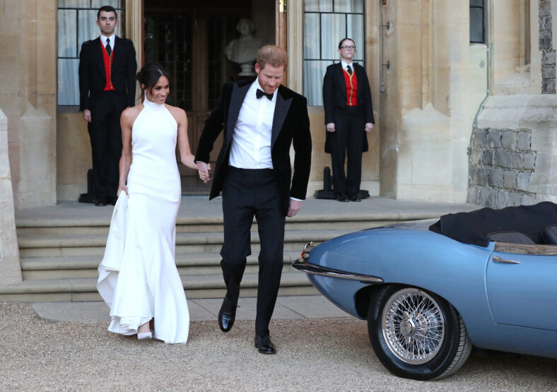 The Duke and Duchess of Sussex Prince Harry and Meghan Markle drive in an electric Jaguar car