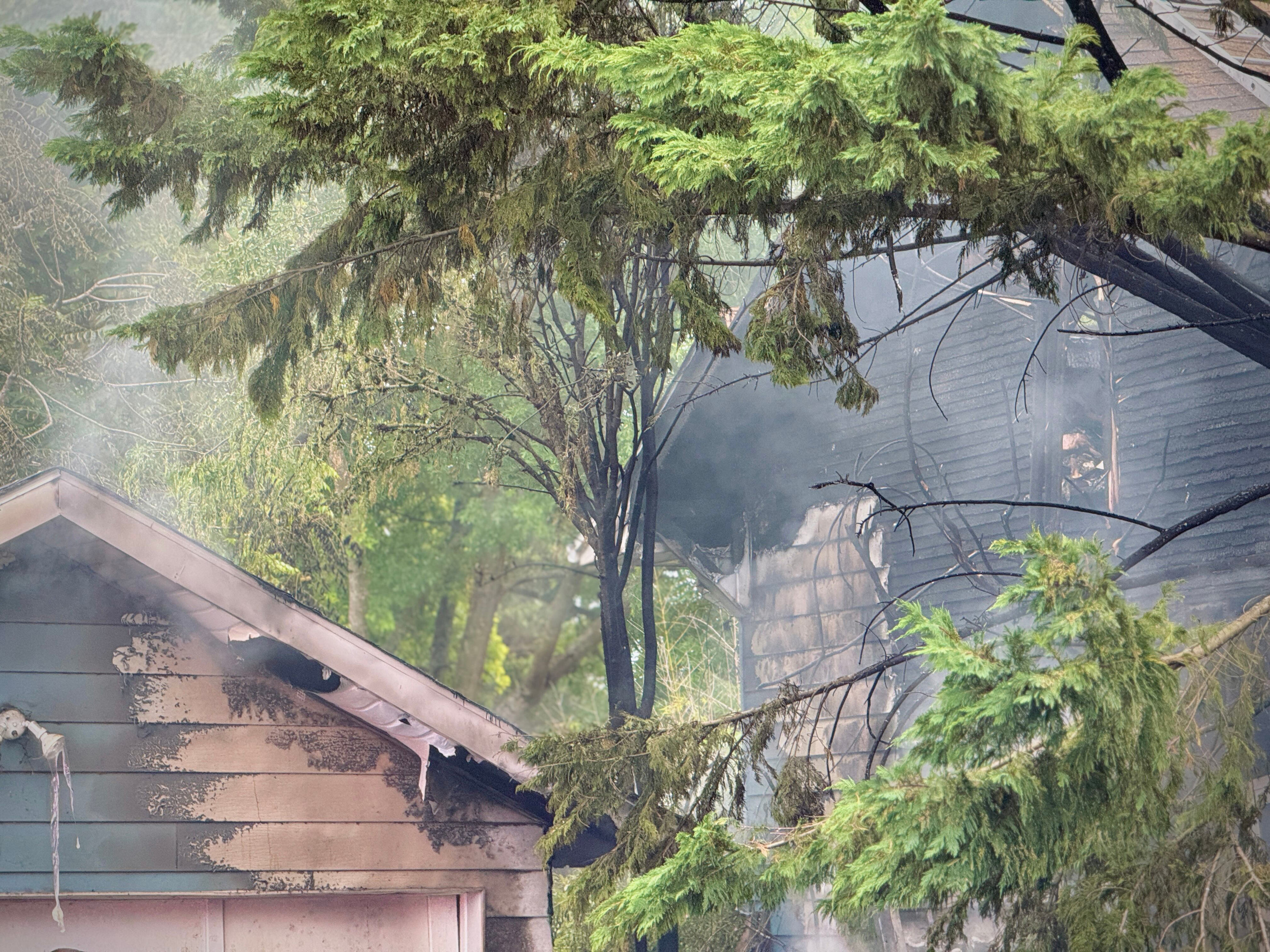 Crews rescue man from roof of burning home in SE Portland