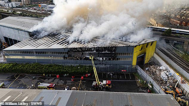 Around 100 firefighters battle huge blaze at recycling centre as smoke ...