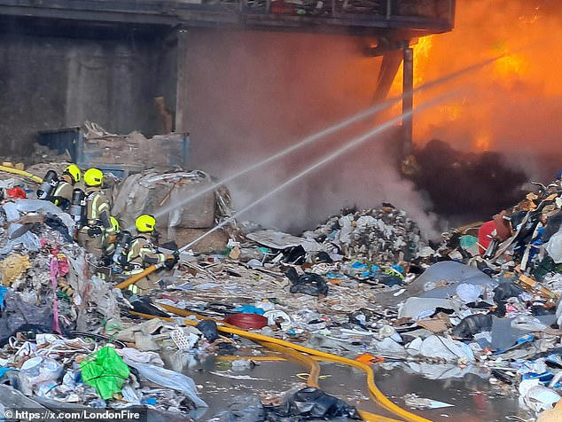 Around 100 firefighters battle huge blaze at recycling centre as smoke ...