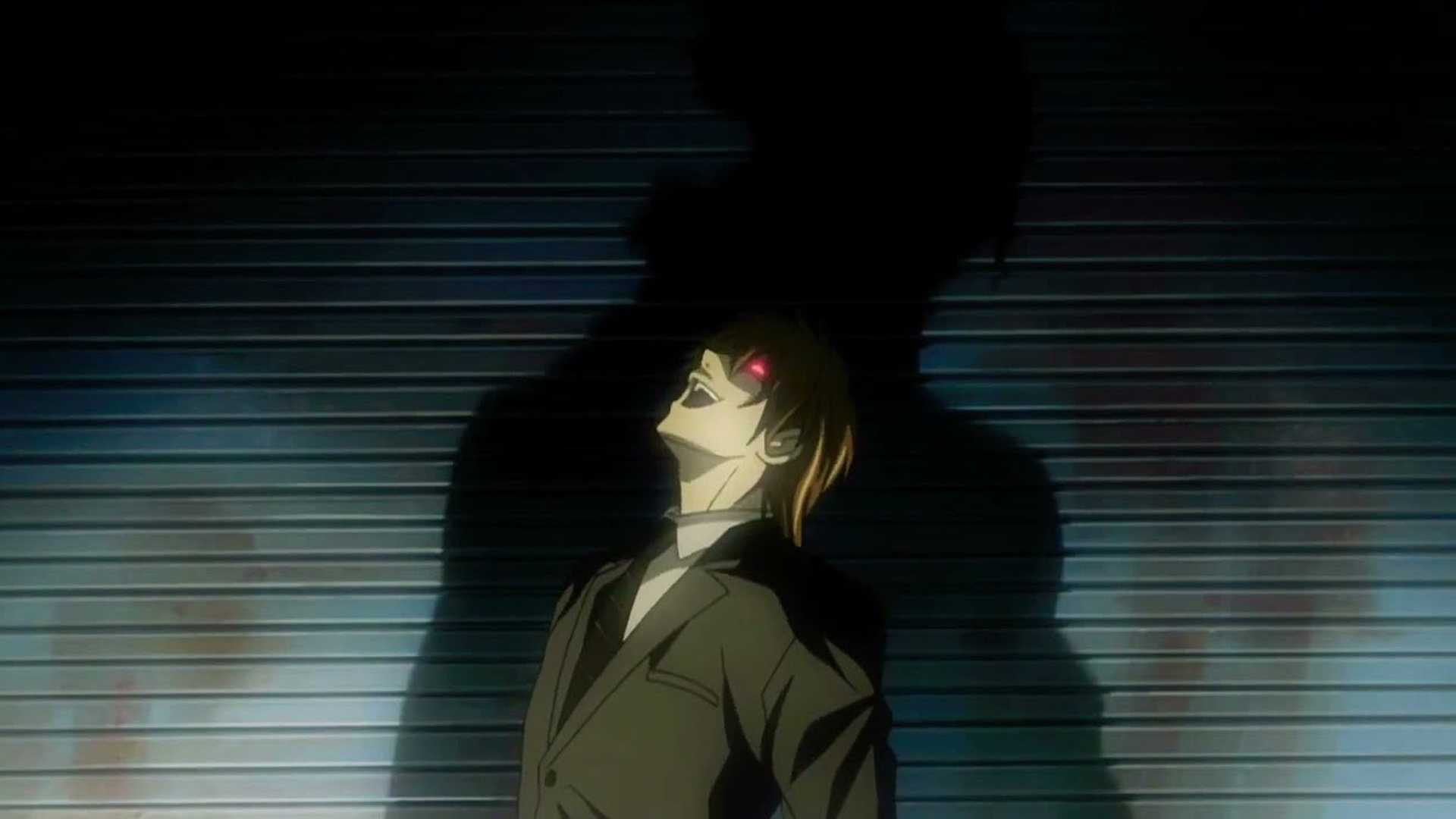 Light Yagami laughs as his shadow towers above him in Death Note