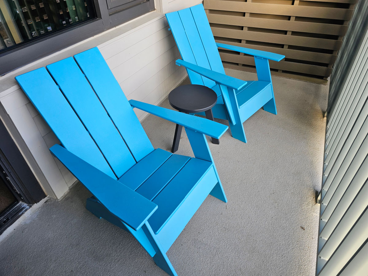 Blue Adirondack Chairs on Balcony of Lodge Room