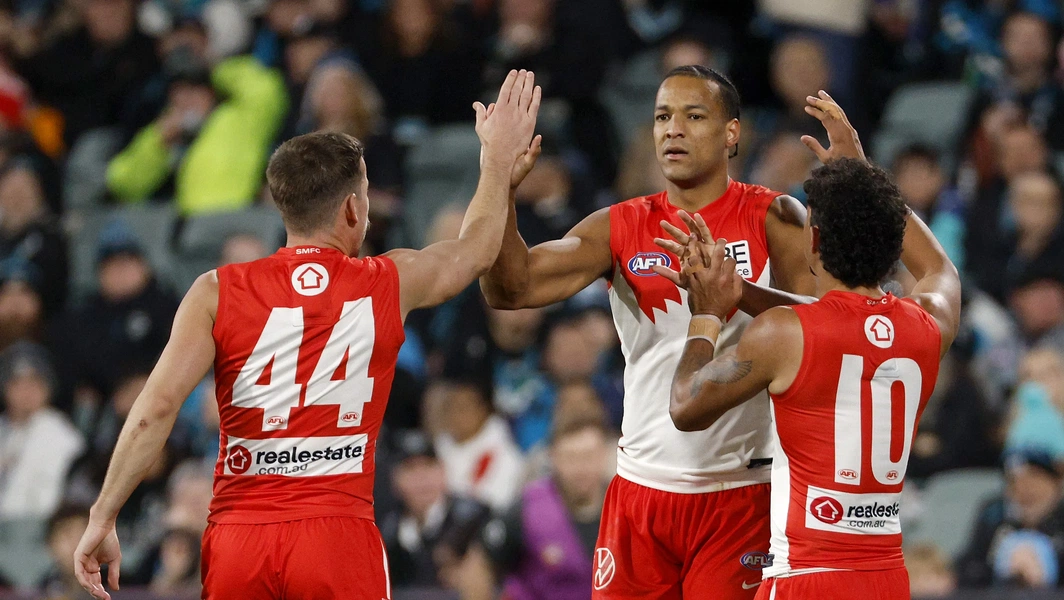 Swans edge Power to join Dockers atop AFL ladder