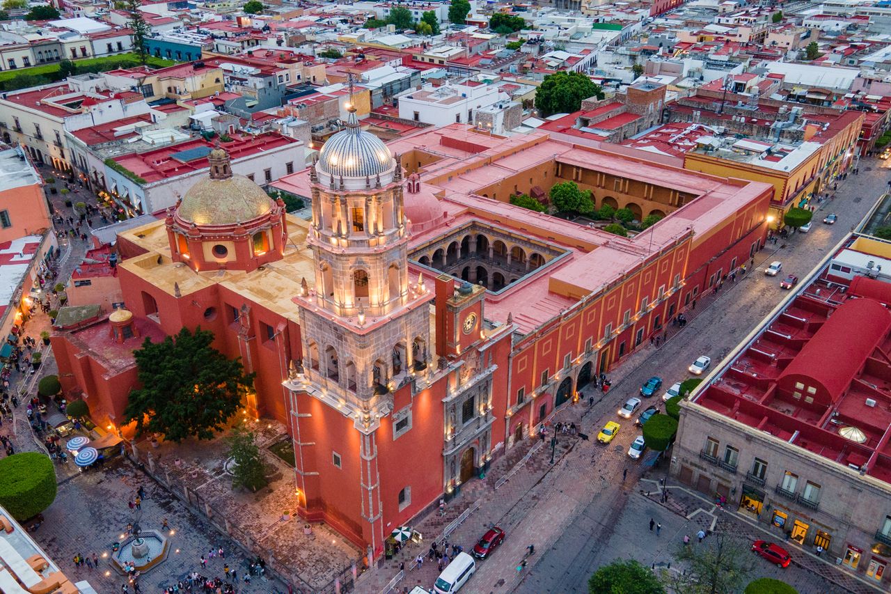 Aeriel view of a large cathedral and surrounding colorful rooftops in Queretaro Mexico