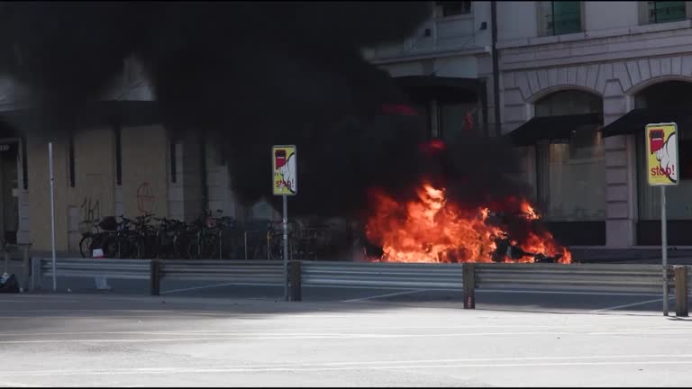 Tesla set on fire, windows smashed in G7 protest
