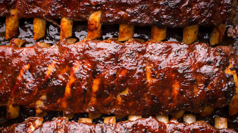 What's the purpose of a rib rack, and how does it benefit your barbecuing?
