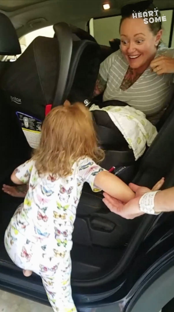 Little girl meets her newborn twin sisters for the first