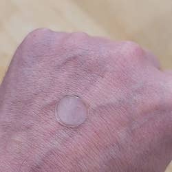 white sticker on hand