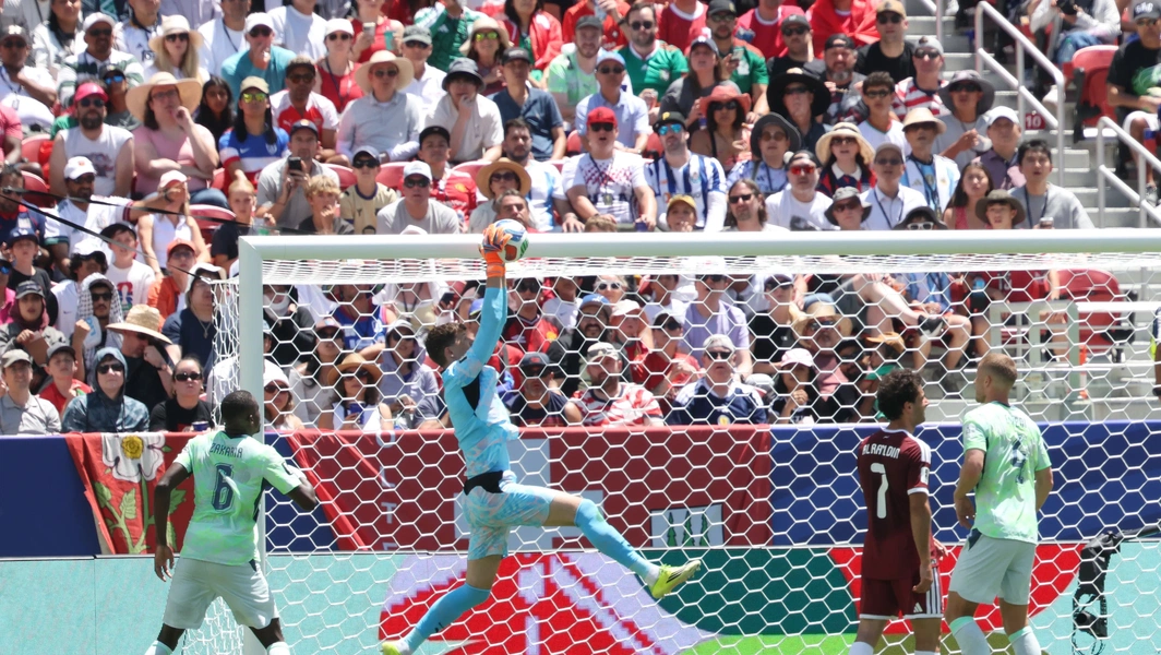 Khoukhi’s stoppage-time header earns Qatar historic draw