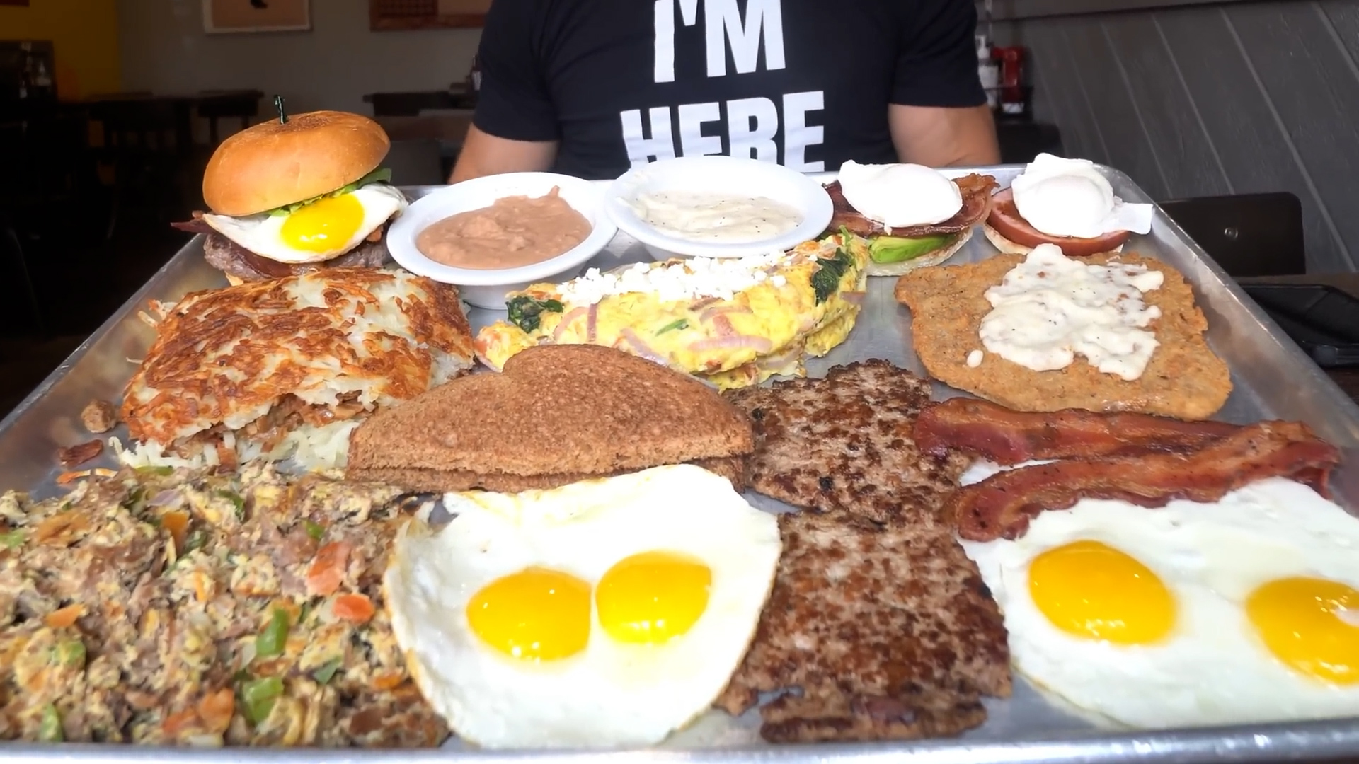 He takes on giant breakfast challenge loaded with eggs, steak and hash ...