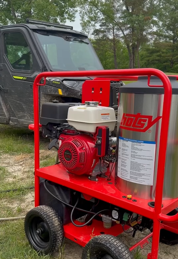 Cleaning a Polaris Ranger with a hot water pressure washer