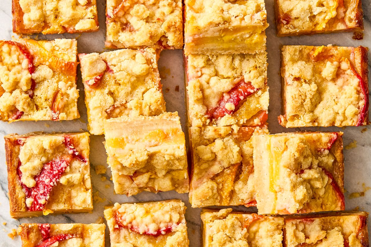 Peach crumb bars cut into square portions