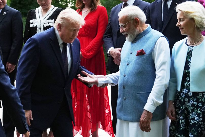 'Unsteady' Trump humiliated as he clings to world leader while climbing