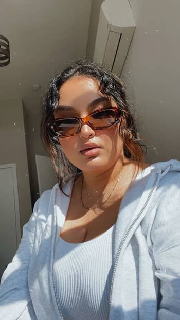 reviewer wearing the tortoiseshell shades