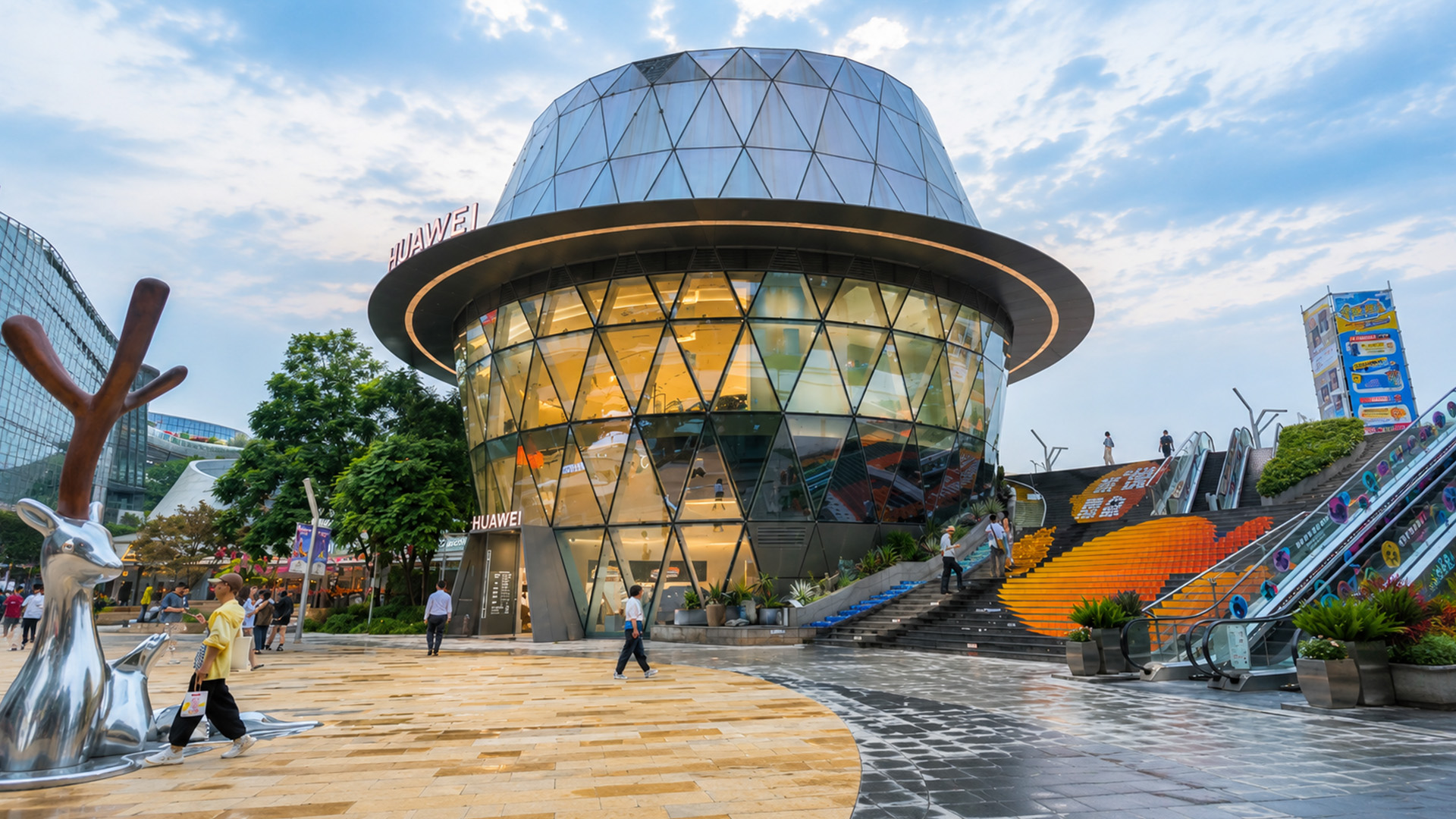 Walking through China’s modern plaza with a giant glass tech building